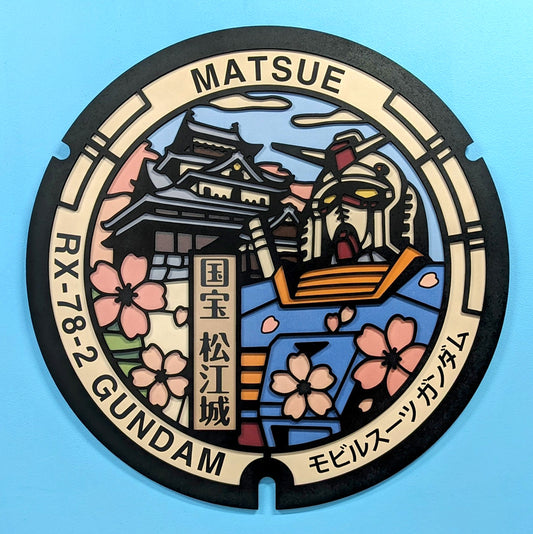 Plaque d'égout du Japon : Gundam de Matsue